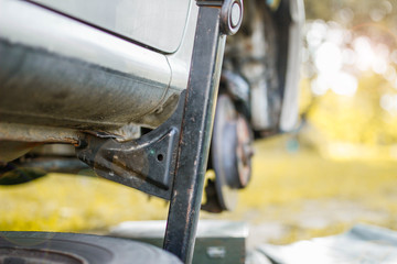 wheel replacement, the machine is lifted on a jack. breakdown on the road.
