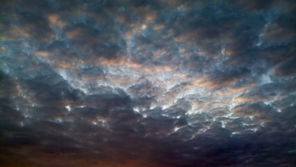 Cloudy clouds in the evening at sunset. Nature, weather and background.