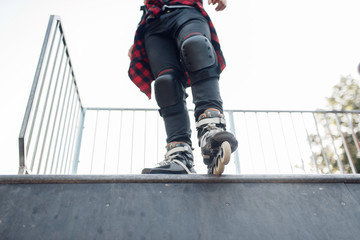 Roller skating, male skater standing on ramp