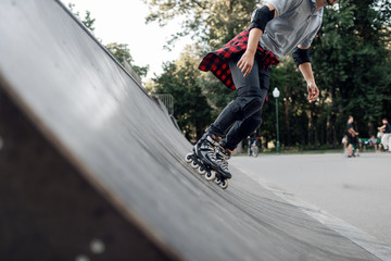 Roller skating, young skater rolling off the ramp