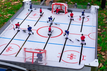 Table hockey, in nature. The concept of entertainment and attraction of people to sports and active lifestyles.