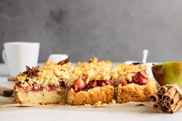 Crumble cakes with apple, red berry jam and spices filling and a cup of coffee. Autumn breakfast or dessert.