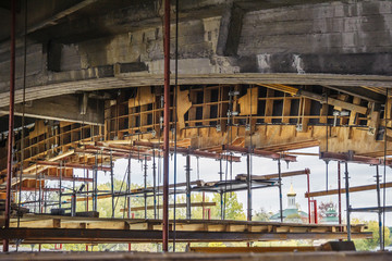 Wooden formwork with scaffolding for the construction of a bridge.
