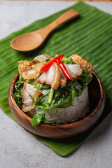 Stir-fried kale vegetable with rice and crispy pork ready to serve , food by order , thai street food (Ka-na-moo-krob)