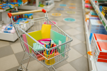 Cart with office supplies in stationery store