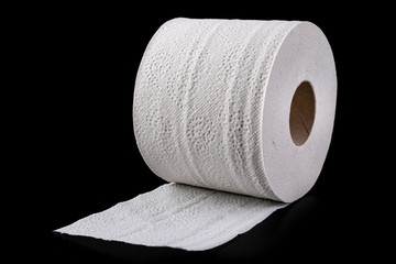 White soft toilet paper on a dark table. Personal hygiene accessories.