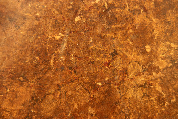 Antique,  honey-coloured, book cover for background. Textured, distressed and marked from ages of use . Grunge background.