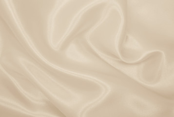 Obraz premium Smooth elegant golden silk or satin luxury cloth texture as wedding background. Luxurious background design. In Sepia toned. Retro style