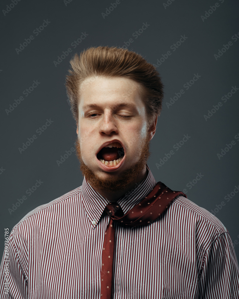 Wall mural Strong wind blowing in male face, funny emotion