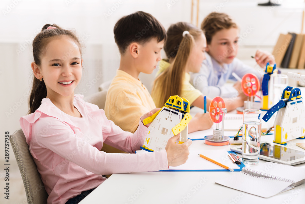 Aufkleber stem education. girl creating robot at lab
