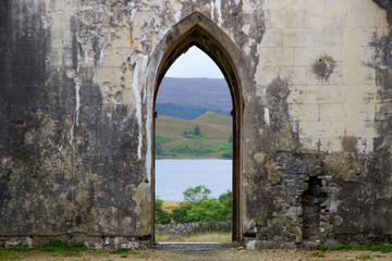 Fototapeta na wymiar View of Lake Valley through Old Abandoned Arch Way