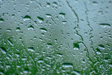 Natural water drop background.CAR Window glass with condensation of natural water drops .Abstract photo.