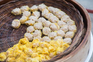 dim sum dumpling on steam basket bamboo with shirmp and pork chinese breakfast