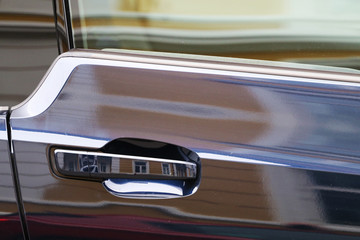 Buildings reflected onto cars