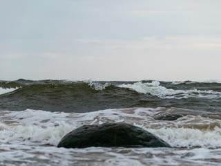 Fototapeta premium Big breaking sea wave on a sandy beach on the Baltic Sea