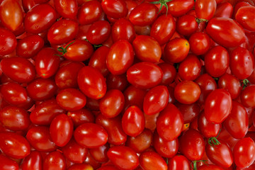 red cherry tomatoes closeup. Background, texture