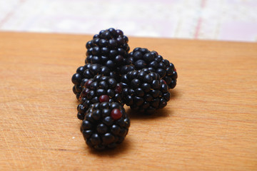 Background of fresh fruits and berries. Ripe blackberries. Mix berries and fruits. Top view. Background berries and fruits. Black food.