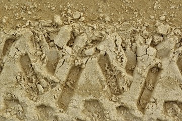 truck tracks in the yellow sand.texture