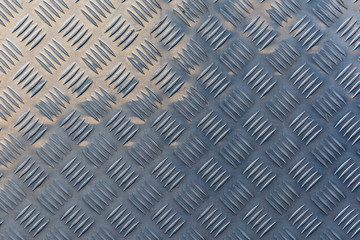 Aluminum dark painting with rhombuses. Abstract background for the project and design.