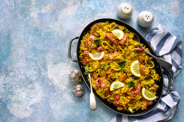 Paella - traditional dish of spanish cuisine. Top view with copy space.
