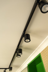 Modern LED lights in black on the mounting rail.