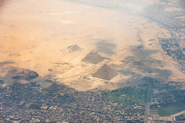 The Giza pyramid complex, also called the Giza Necropolis viewed from airplane window - obrazy, fototapety, plakaty
