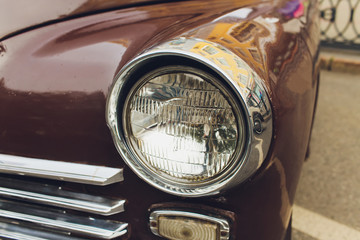 Retro styled image of a front of a classic car.