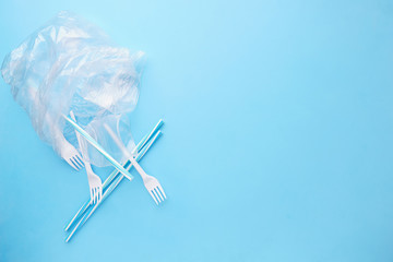 Plastic garbage on blue background. Ecological, environmental pollution, recycling and zero waste...