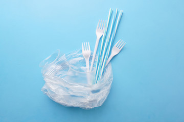 Plastic garbage on blue background. Ecological, environmental pollution, recycling and zero waste concept