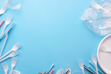 Plastic garbage frame on blue background. Ecological, environmental pollution, recycling and zero...