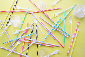 Plastic garbage on yellow background. Ecological, environmental pollution, recycling and zero waste...
