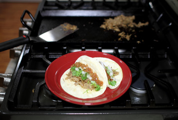 Delicious pulled pork tacos known as 