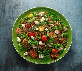 Quinoa salad with green pea, mint, feta cheese, chilli flake, tomatoes and vegetables. healthy diet food