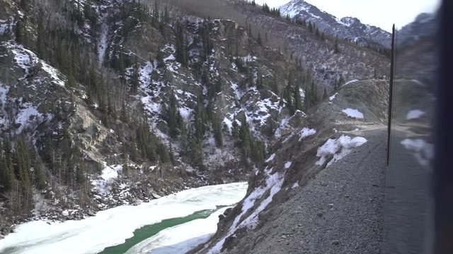 passing over a bridge on the alaska railroad train in winter