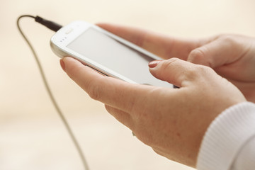 close-up of a woman using her mobile phone