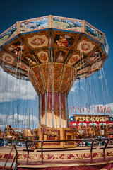 Seat swing at a local fair with blue sky