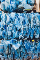 Plastic pressed bales at the modern waste hazardous processing plant. Separate garbage collection. Recycling and storage of waste for further disposal. Business for sorting and processing of waste.