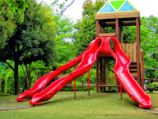 Red three-way slide at the park in Koganei, Tokyo.