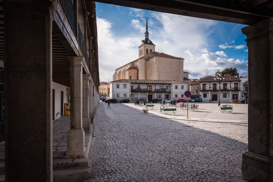View of the arcaded square of Colmenar de Oreja with the Church of Santa Maria in the background, Madrid, Spain.