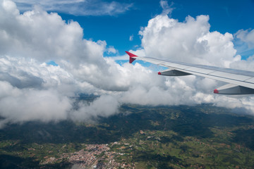 Fototapeta na wymiar Village between mountains in the Andes mountain ranges seen from the an airplane .Colombia.