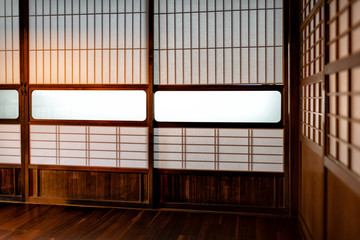 Traditional Japanese machiya house home or ryokan restaurant room with sliding paper doors and natural soft light in Japan