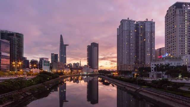 Time lapse of Saigon city skyline with famous Bitexco Tower from day to night. Saigon skyline at Sunset, Cityscape of Ho Chi Minh, Vietnam.