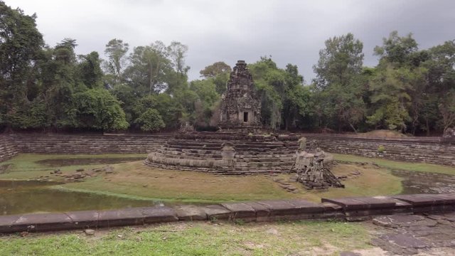 Neak Pean Temple, panoramic view daytime with cloudy sky. Neak Poan temple, artificial island in water tank Angkor, Cambodia.