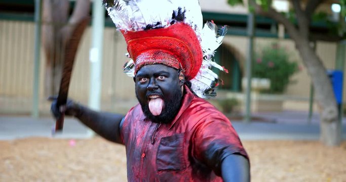 Scary and aggressive Native American apache  with machete fighting, 4K