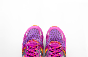 Sport sneakers on the white background with copy space for text, top view. Sport concept. Accessories for fitness and running.
