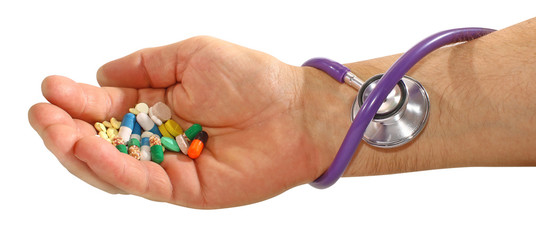 Hands of a young man holding pills, isolated on white background.  concept Medicine and Health.