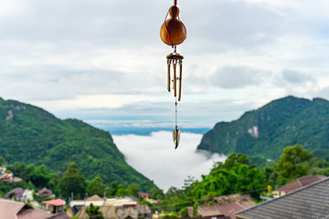 Misty mountain in the morning rainy season over small village at Doi Pha Hee countryside, Chiang Rai Thailand