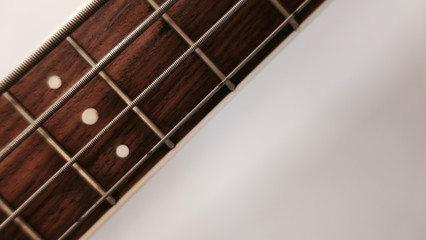 bass guitar neck . color background. closeup