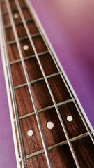 bass guitar neck . color background. closeup