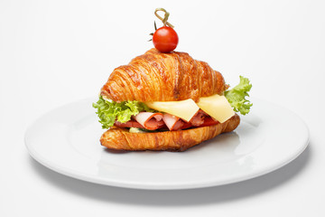 croissant with a cheese and a bacon